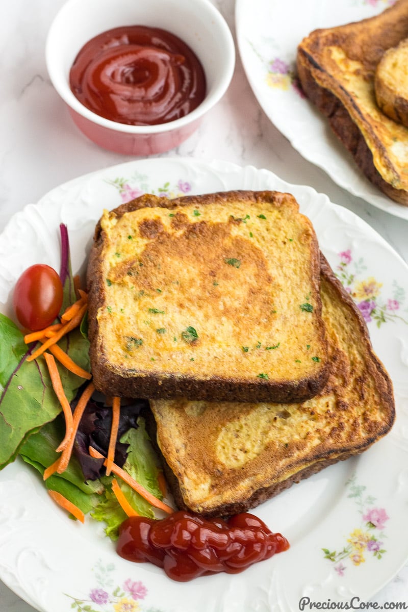 Savory French Toast served with Ketchup and vegetables.