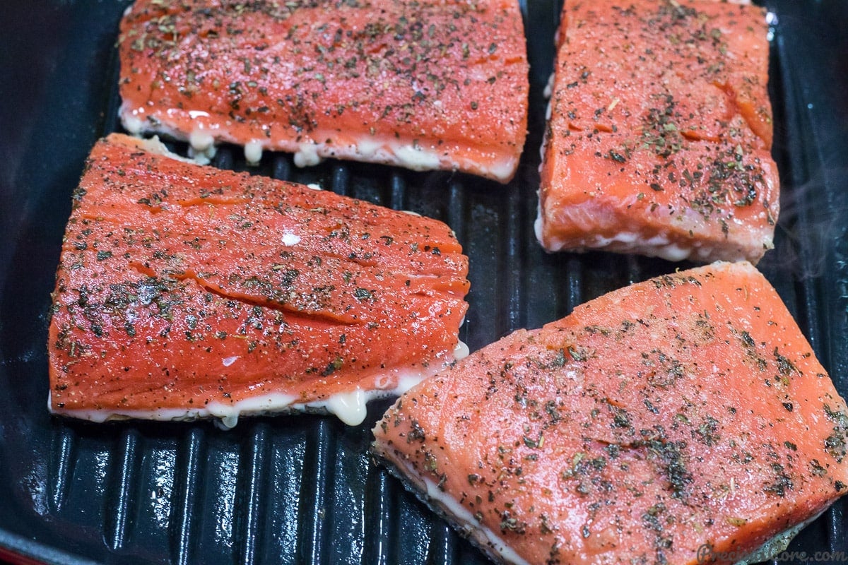 Grilling salmon in pan