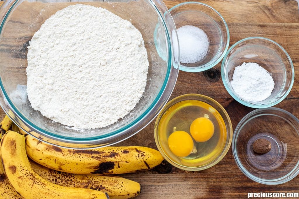 Ingredients for banana fritters on a chopping board