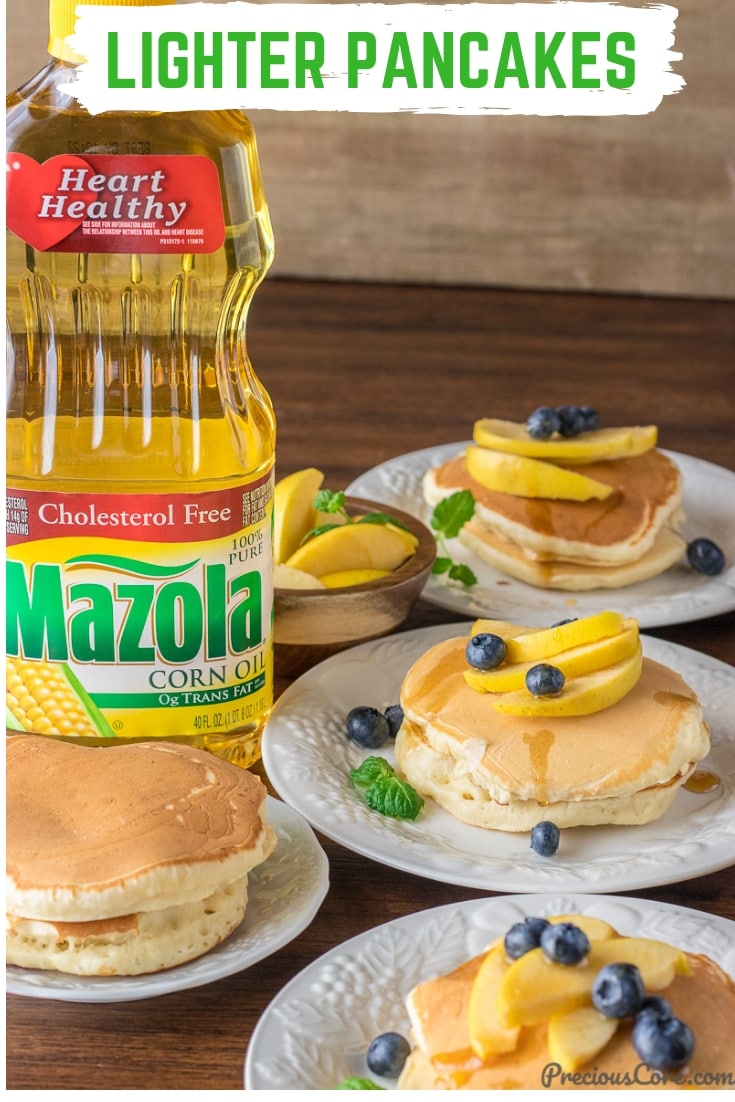 Plates of pancakes with a bottle of Mazola corn oil.