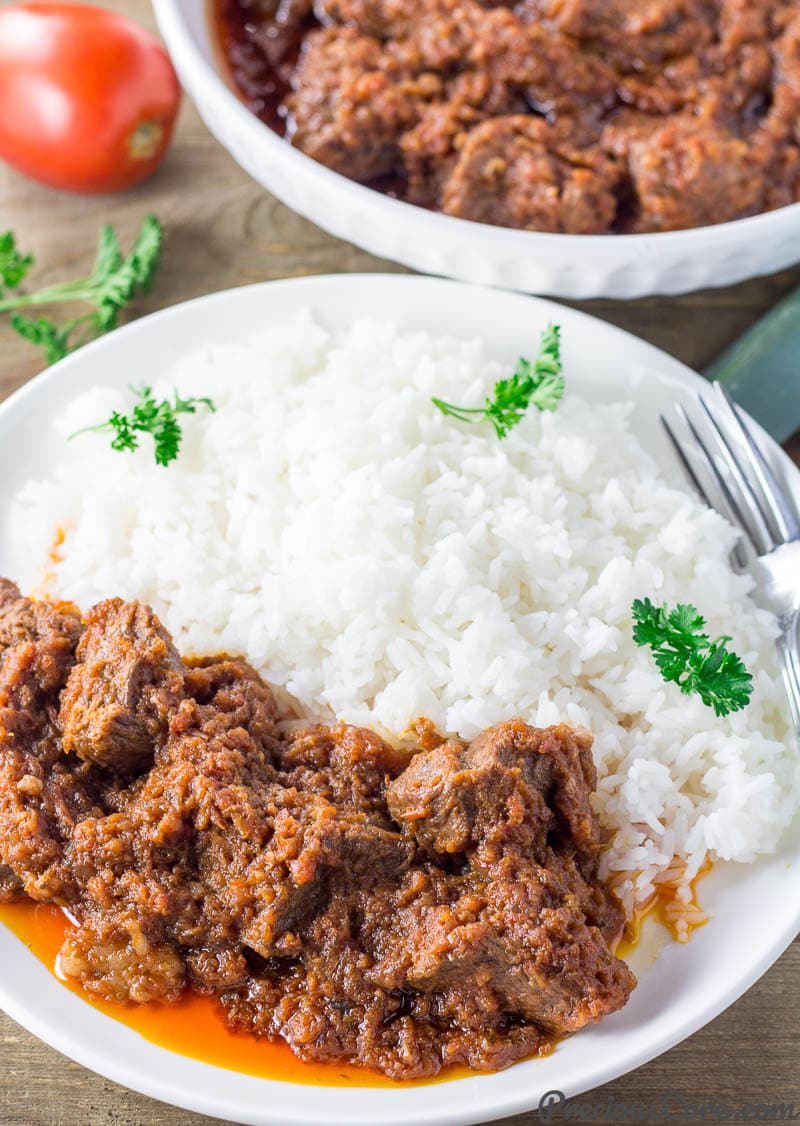 Rice and African Beef Stew on a plate.