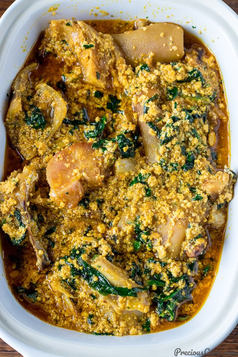 Close-up shot of egusi soup in a bowl.