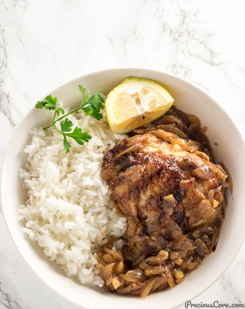 Poulet Yassa or Chicken Yassa served with rice.