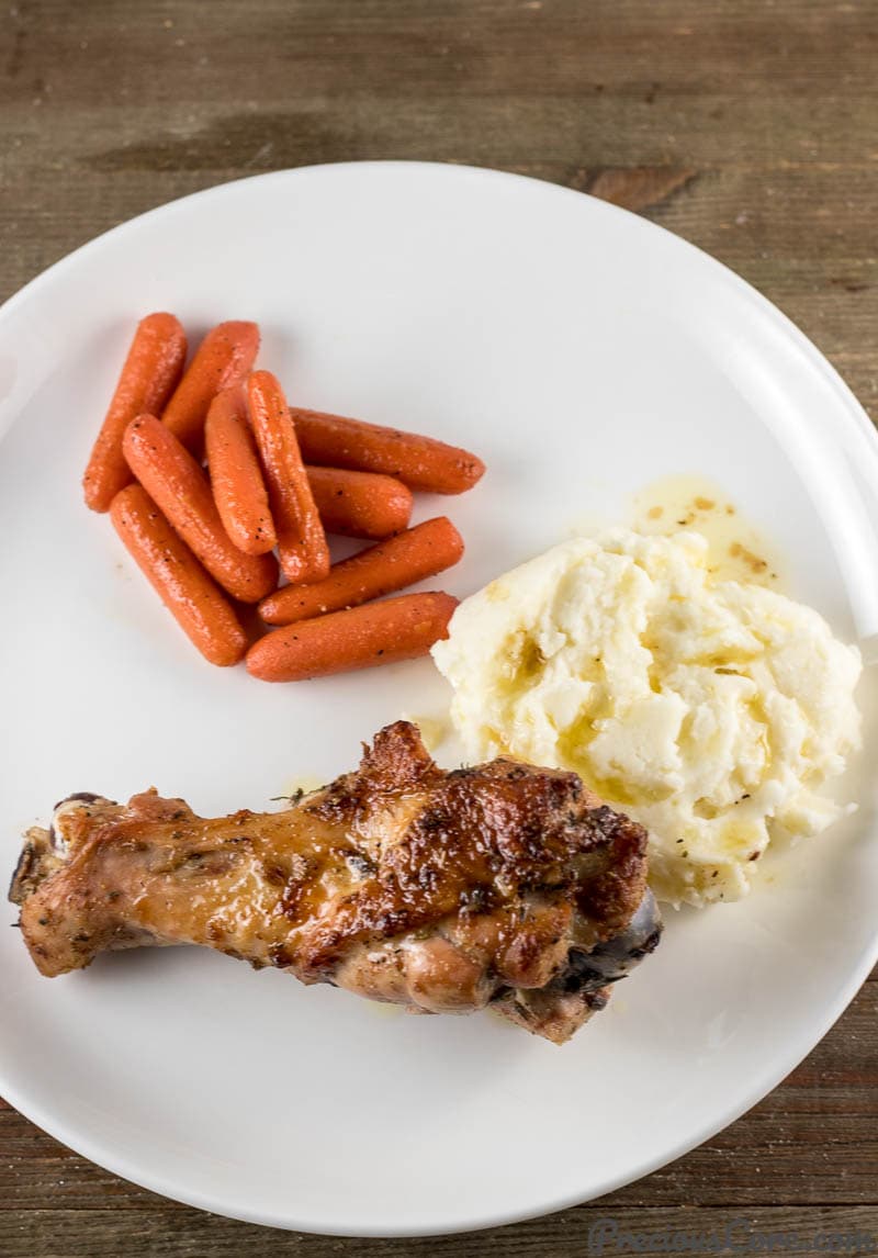 Baked Turkey Wings served with mashed potatoes and sautéed carrots.