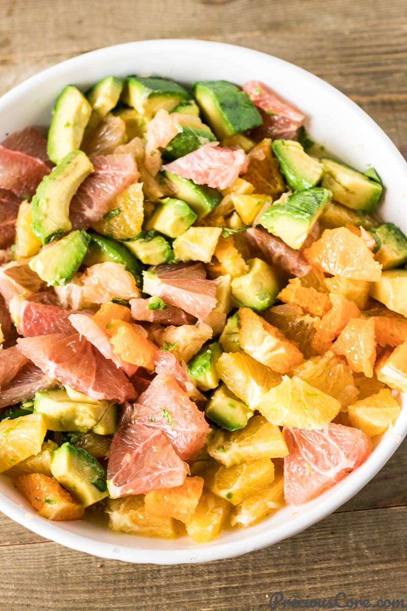 Tossed Citrus Salad with Avocado in a bowl.