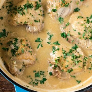 Chicken in White Sauce in a cast iron braiser.