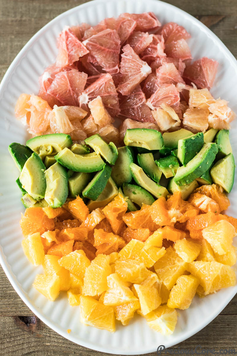 Citrus Salad with Avocado on a white plate.