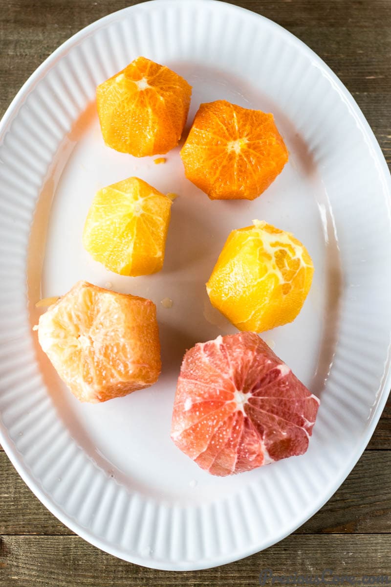 Plate of peeled citrus fruits.