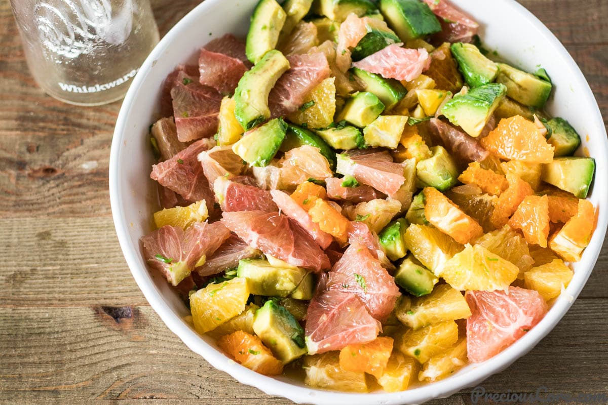 Tossed Citrus Salad with Avocado in a bowl.
