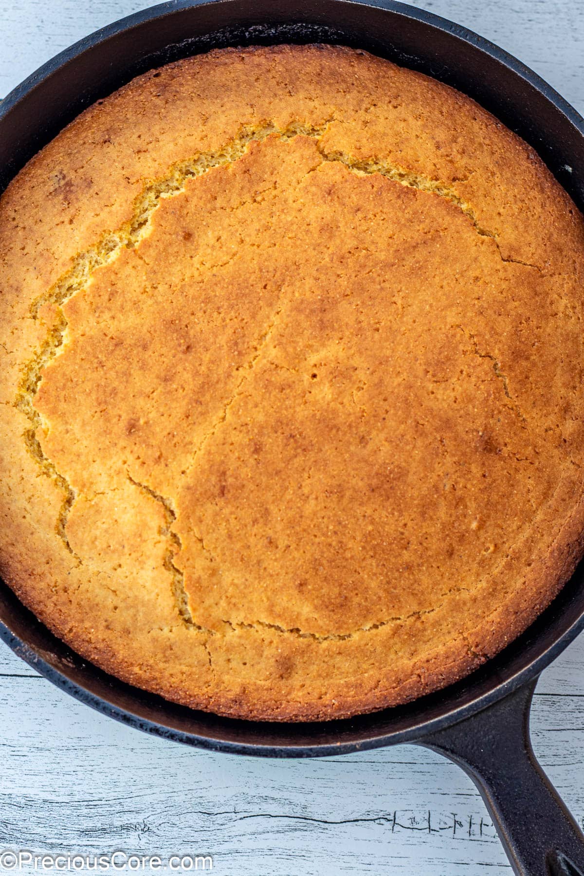 Baked cornbread in cast iron skillet.