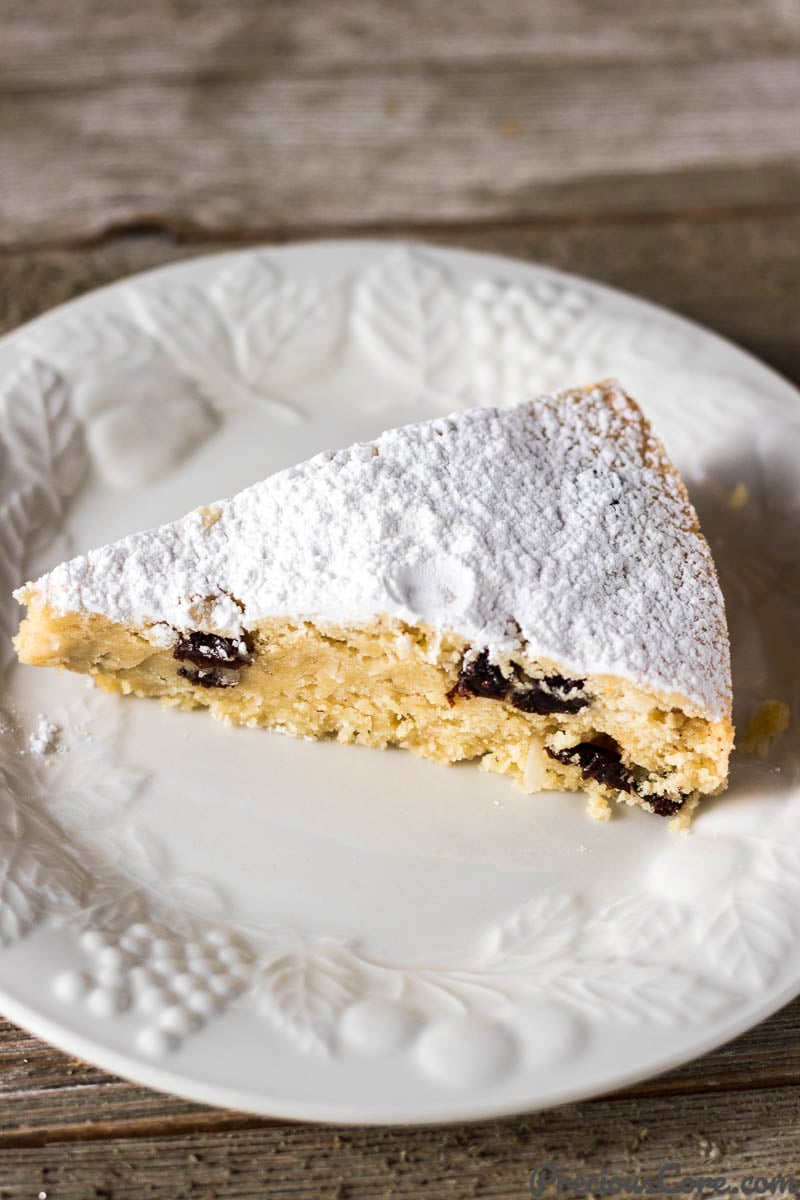 White plate with a slice of Christmas Fruit Cake.