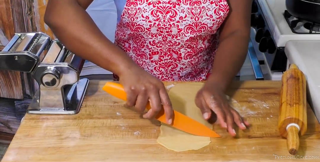Using a knife to cut chin chin