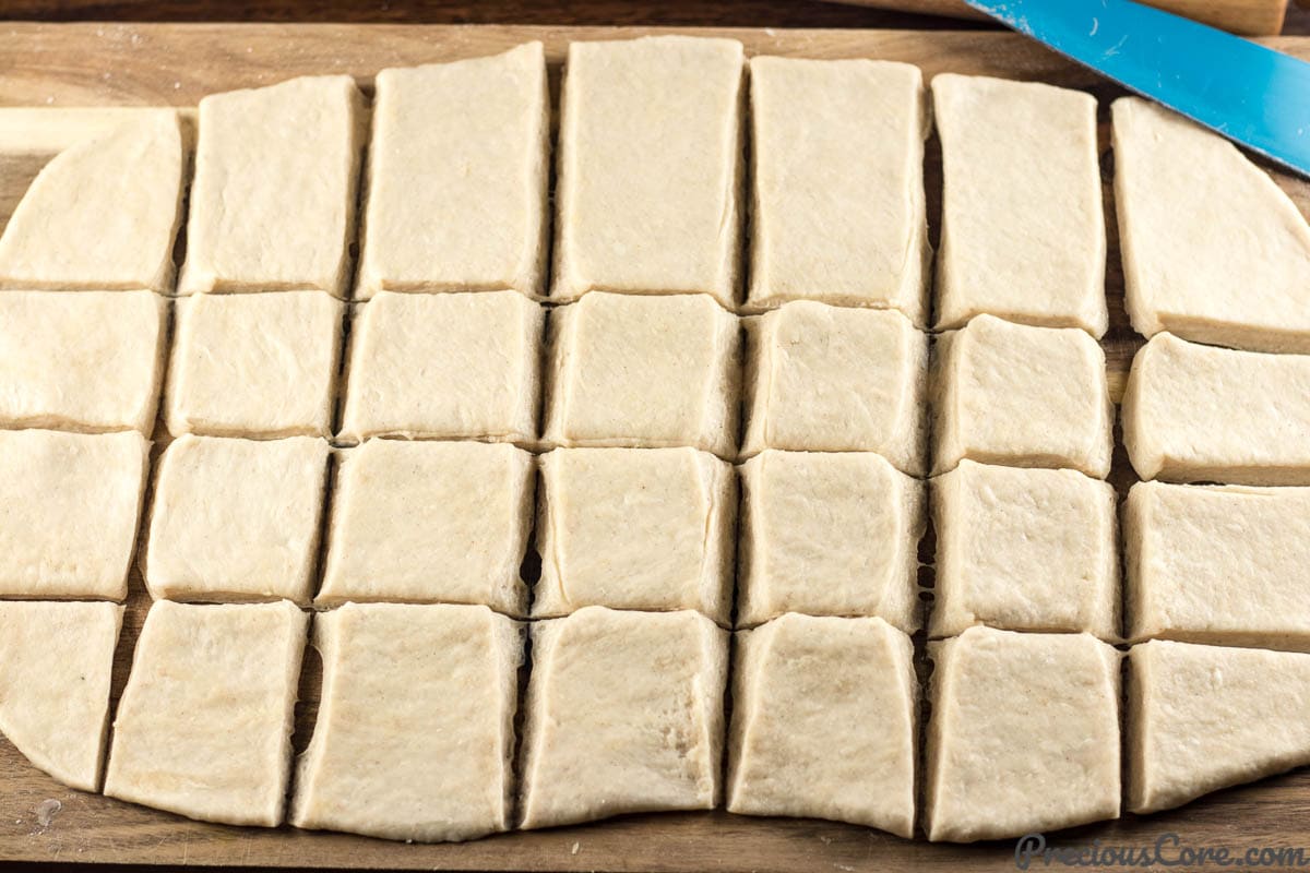 Mandazi dough cut into pieces.