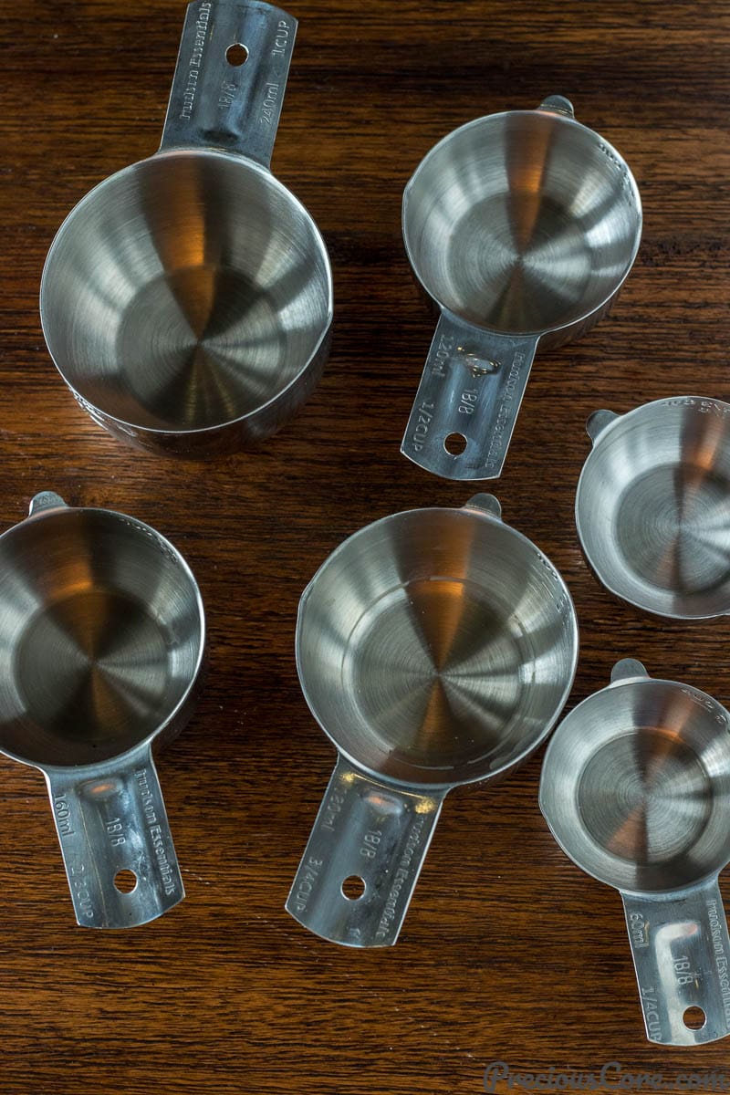 Different sizes of measuring cups on a table