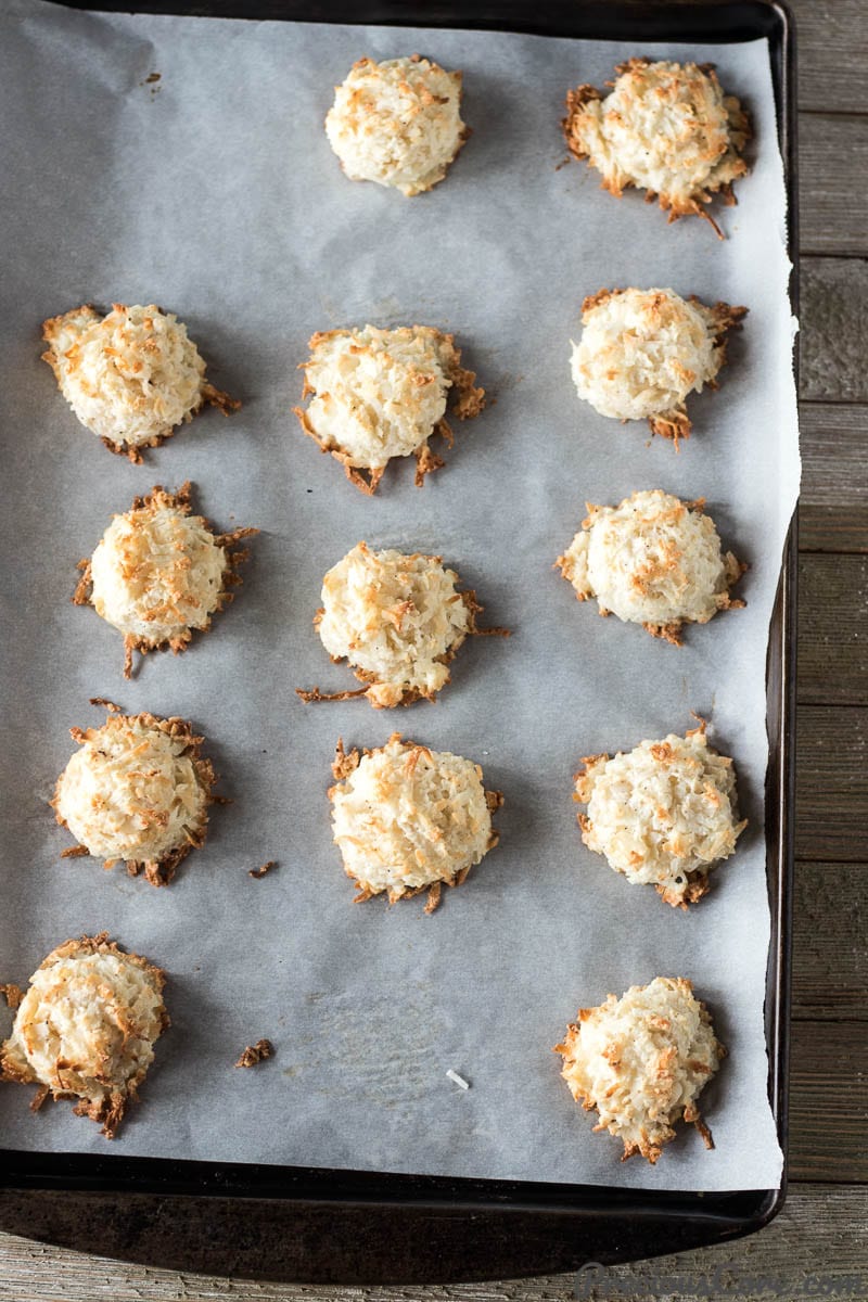 Baked easy coconut macaroons on baking sheet lined with parchment paper