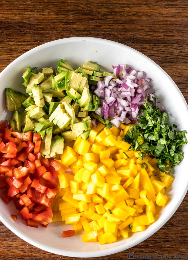 Chopped ingrediients for Mango Avocado Salsa in a bowl