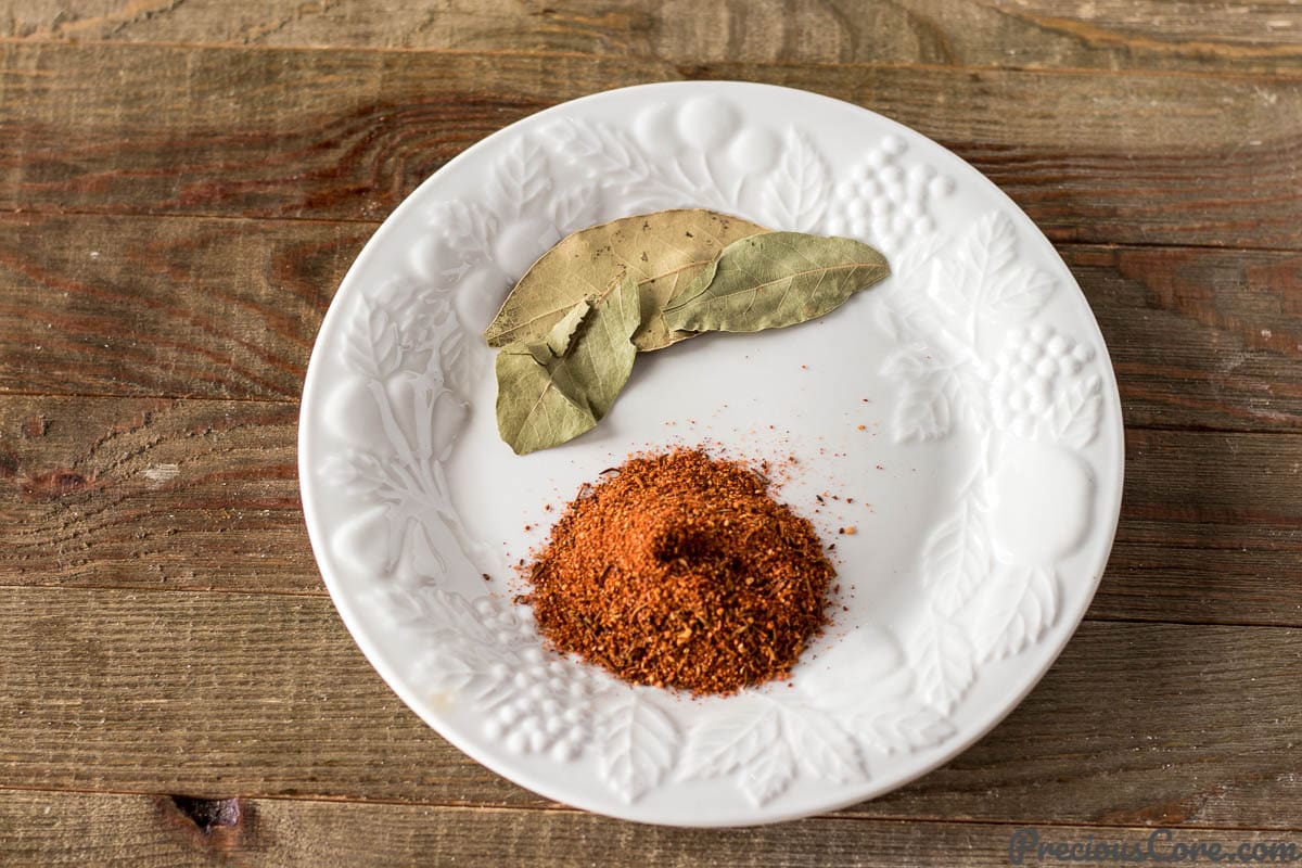 Plate with bay leaves and Creole seasoning.