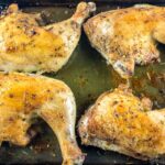Baked Chicken Leg Quarters on baking tray