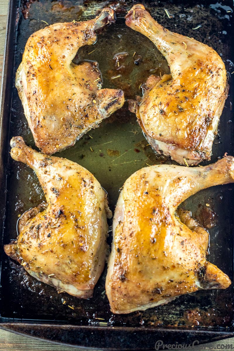 Baked Chicken on a tray with liquid oozing out