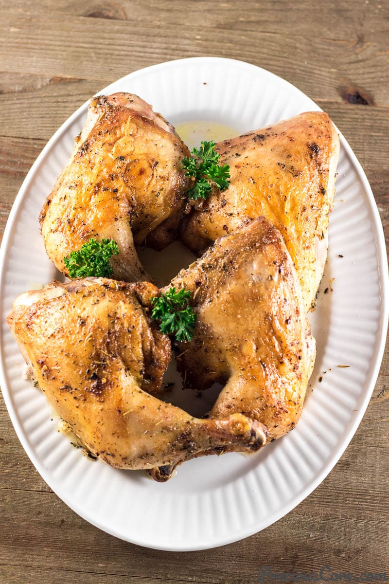 Chicken leg quarters on serving tray 