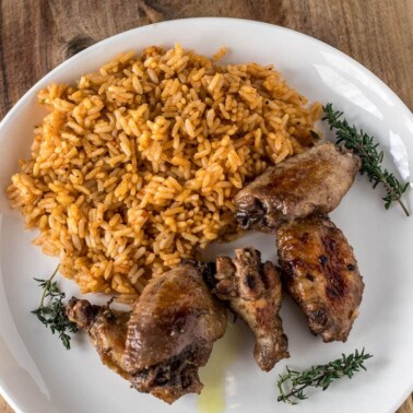 Jerk chicken on a plate and rice