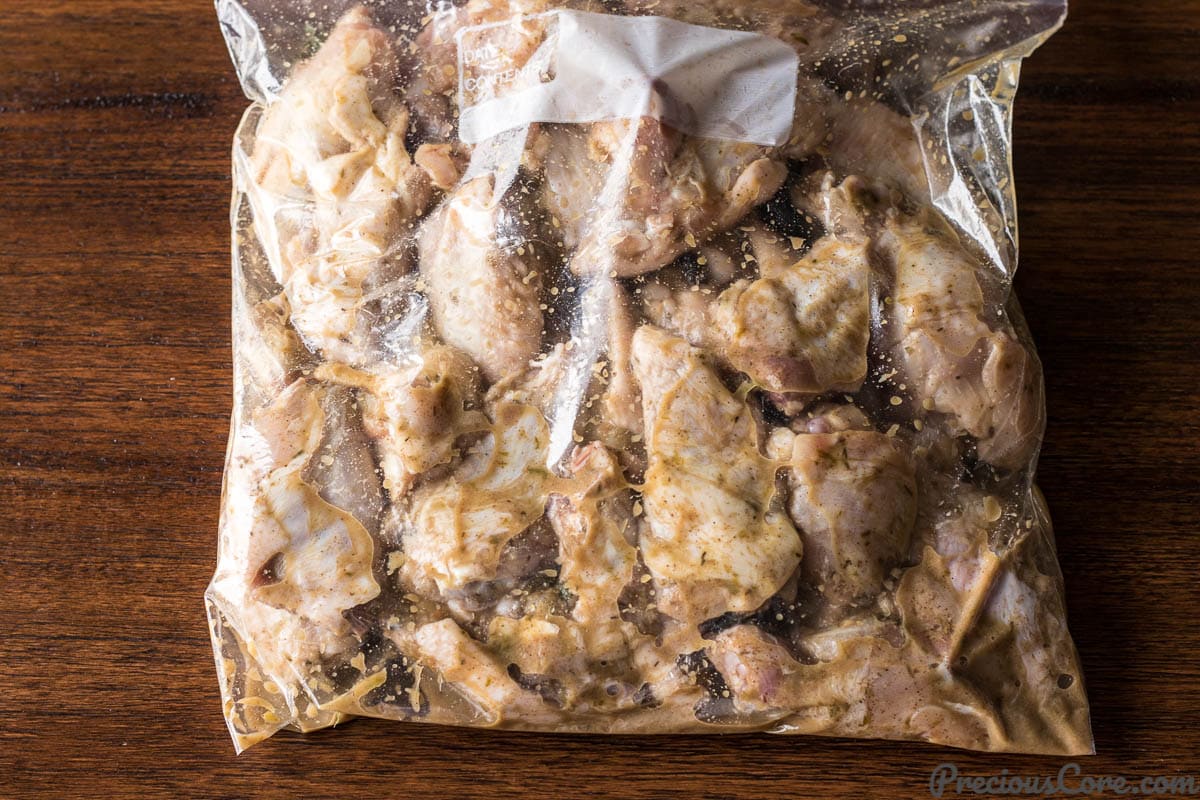 Jerk chicken wings marinating in a Ziploc Bag