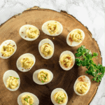 Deviled eggs on a serving platter.