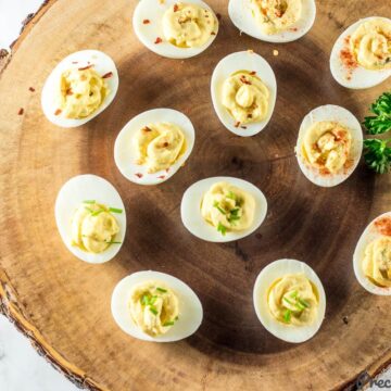 Deviled Eggs on a wooden board.