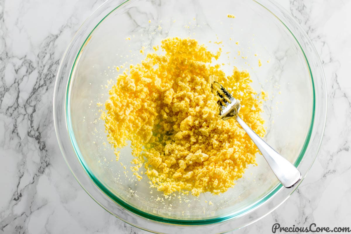 Mashing egg yolks for deviled eggs