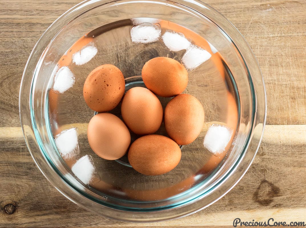 Hard boiled eggs in water and ice