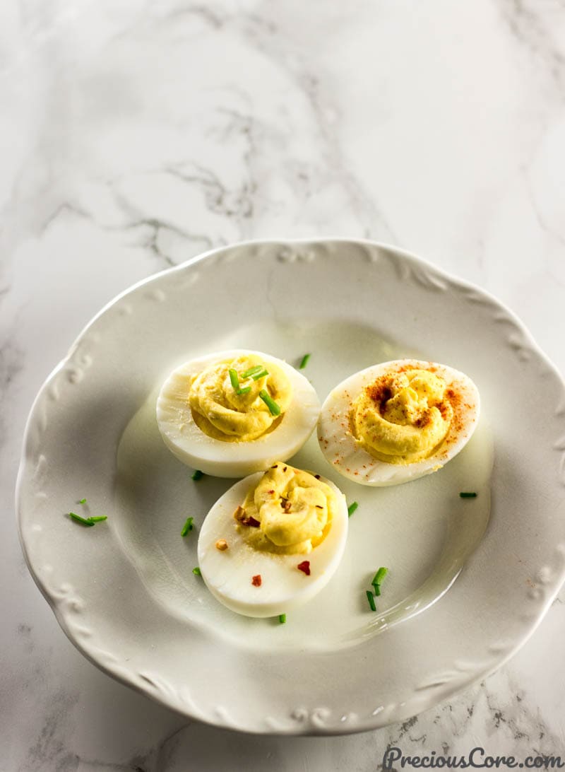 Small plate with three deviled eggs.