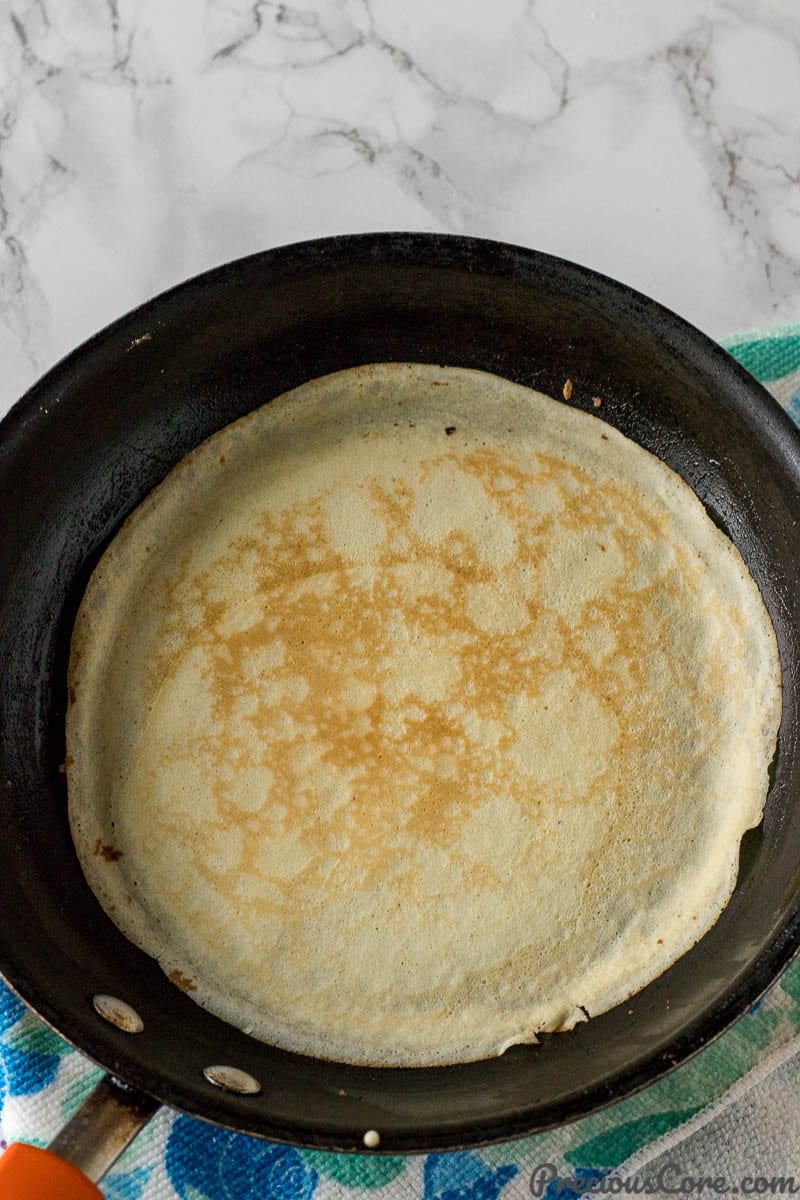 A crepe on a skillet