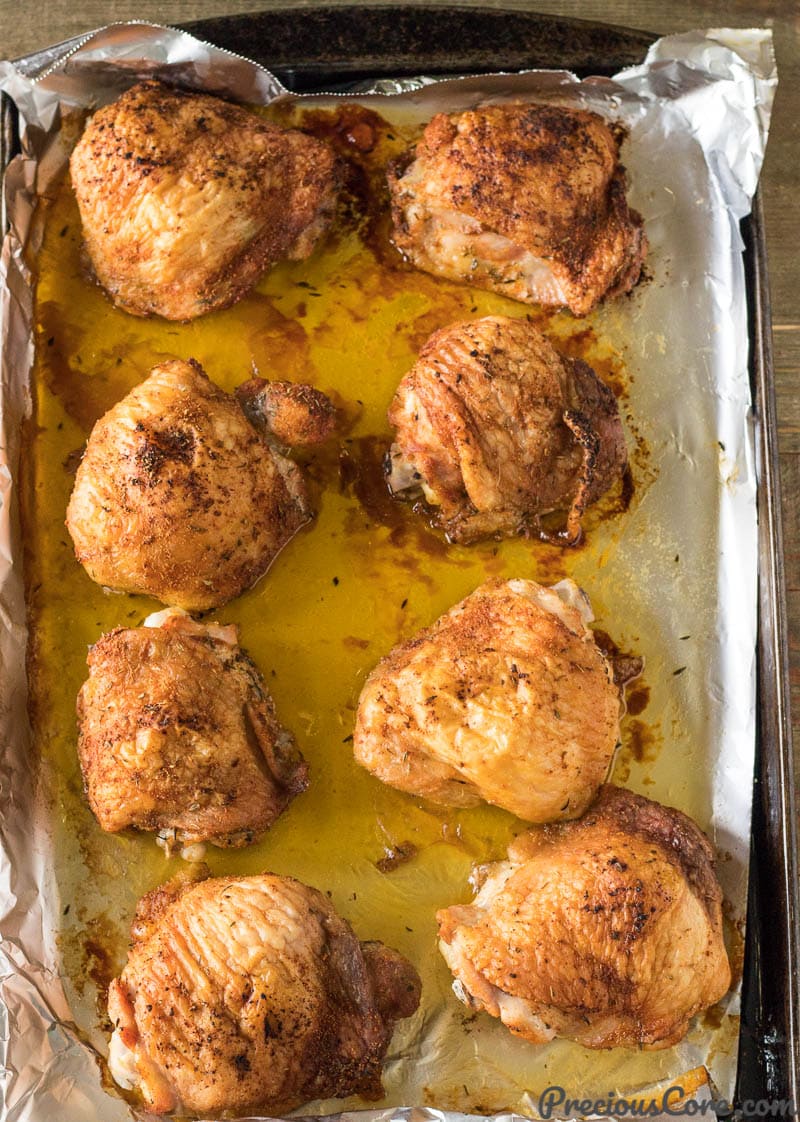 just baked chicken thighs on a baking sheet