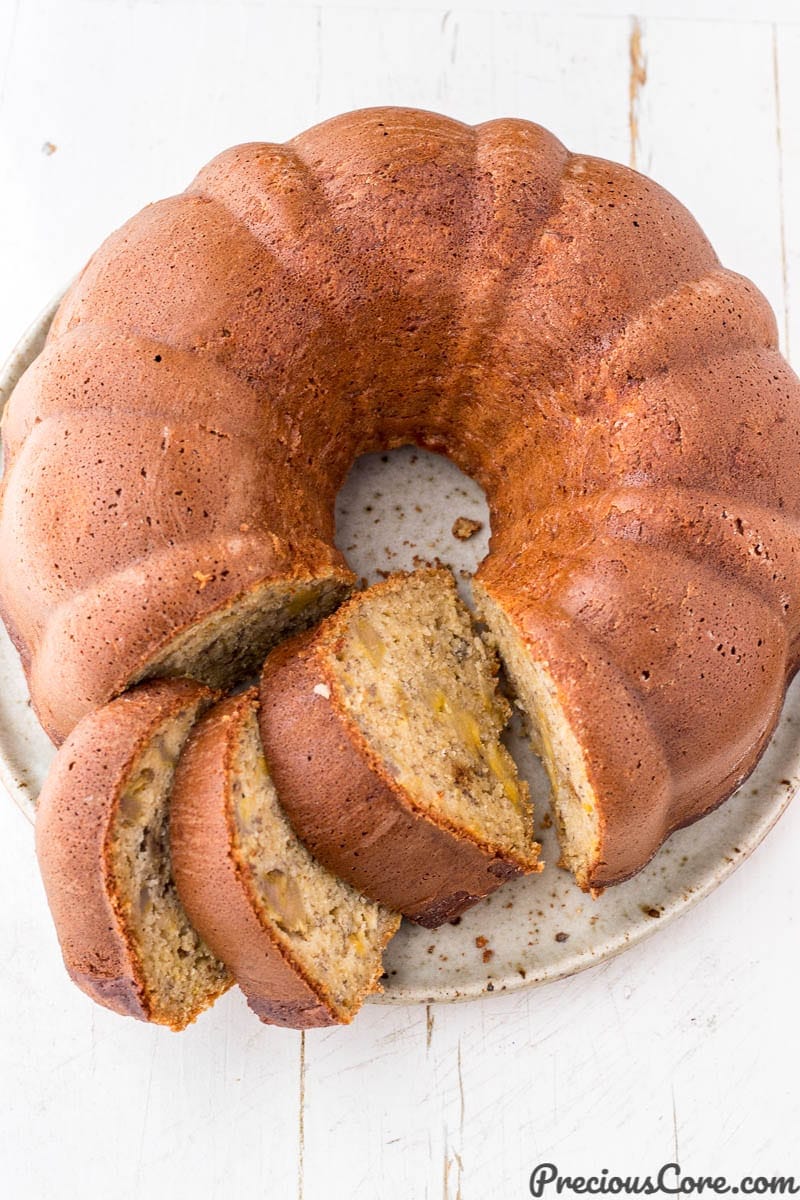 Sliced plantain bundt cake on a plate.