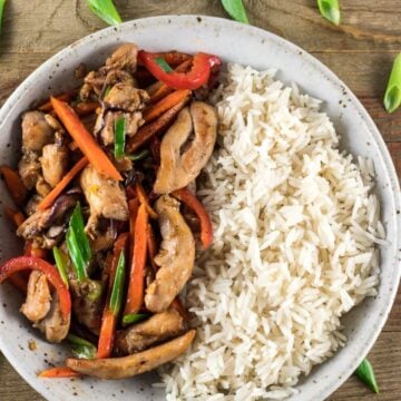 A bowl of rice and chicken stir fry. Easy dinner recipe for family