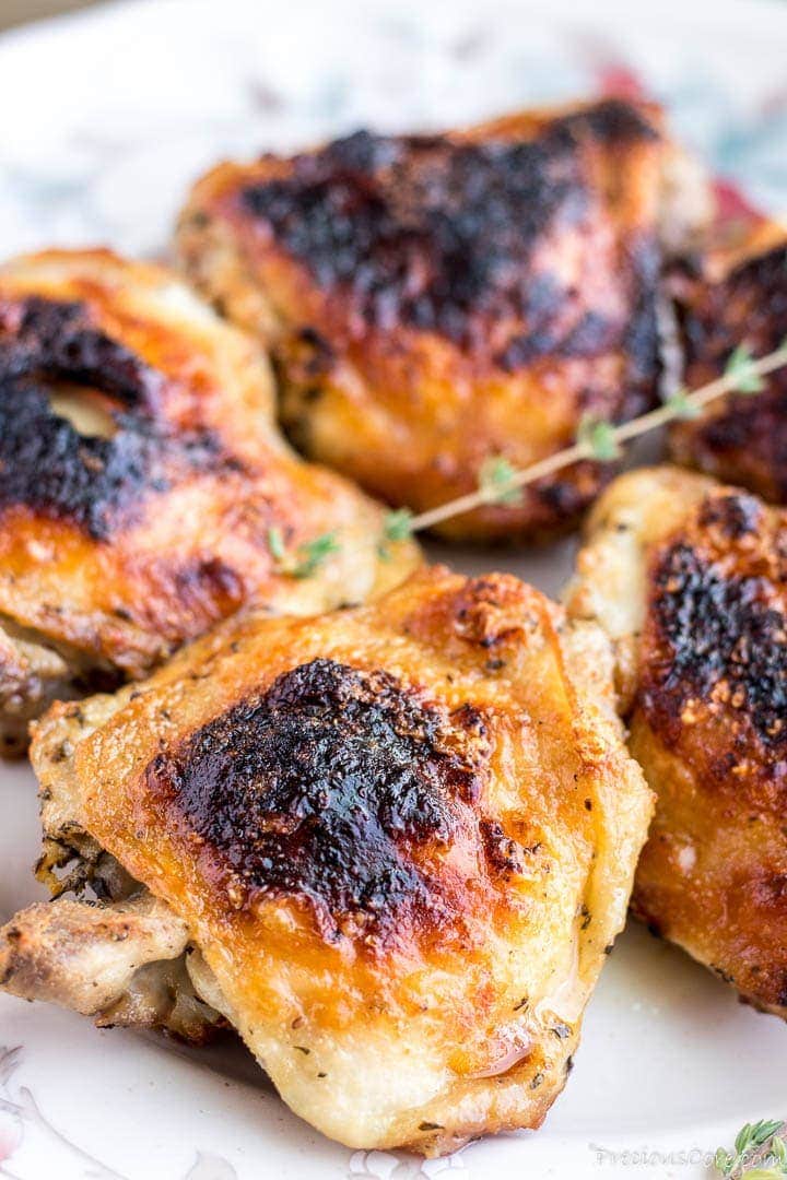 Grilled chicken thighs on a platter