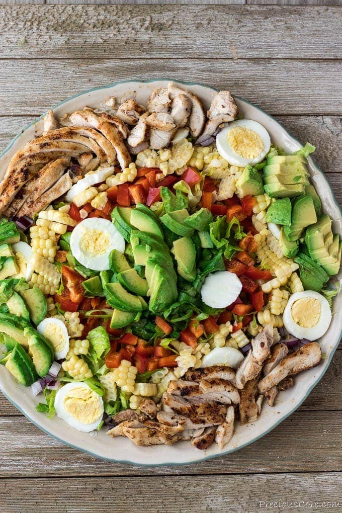 Chicken and veggies laid out on a platter