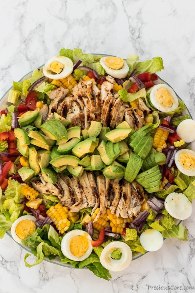 Healthy chicken avocado salad on platter