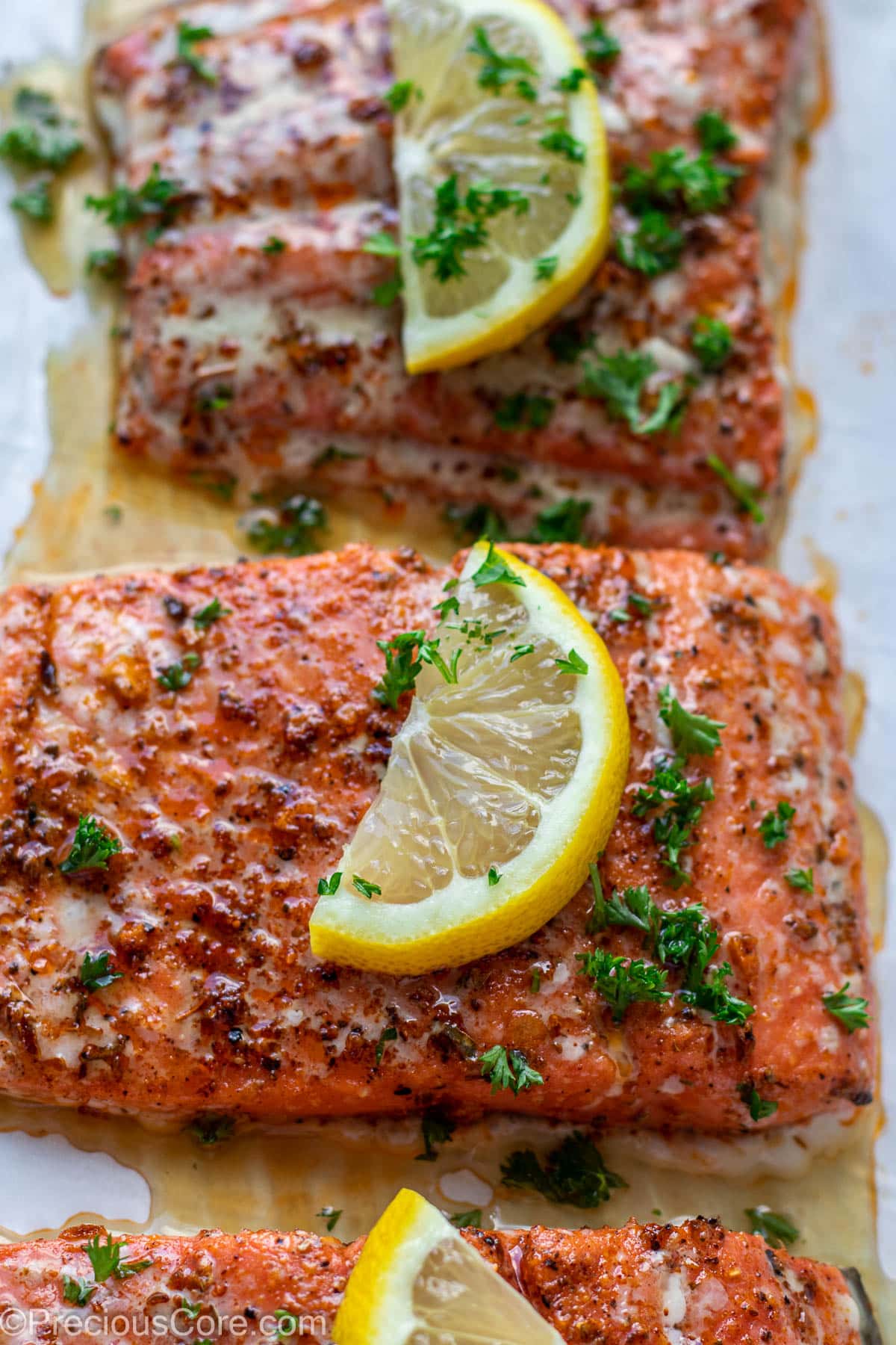 Baked salmon on parchment paper.