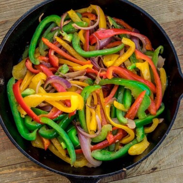 Sauteed peppers and onions in a skillet