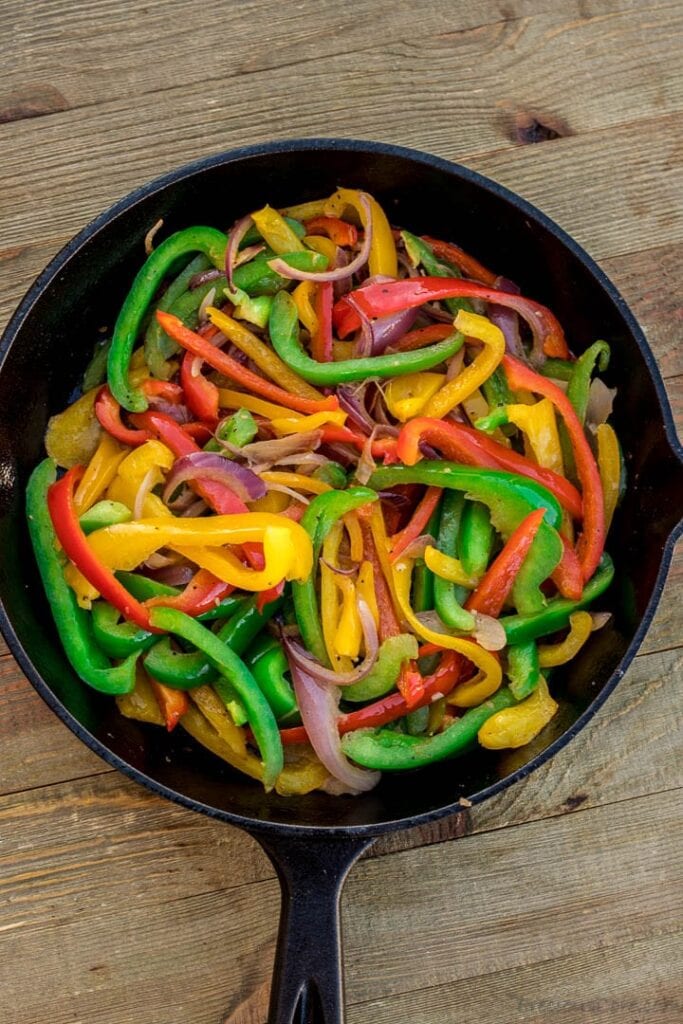 Sauteed peppers and onions in a skillet