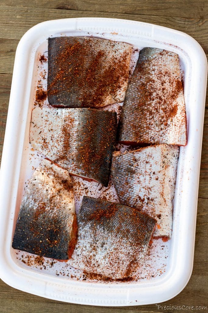Salmon with seasoning sprinkled over.