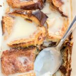 Bread pudding in dish with bread pudding sauce