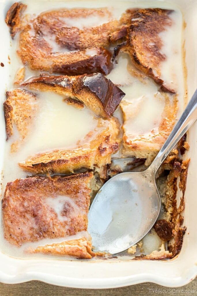 Bread pudding in dish with bread pudding sauce