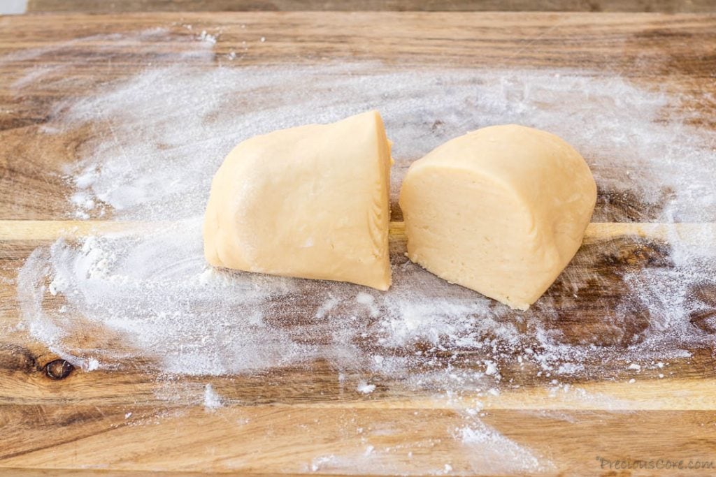 Pie dough on a floured chopping board.