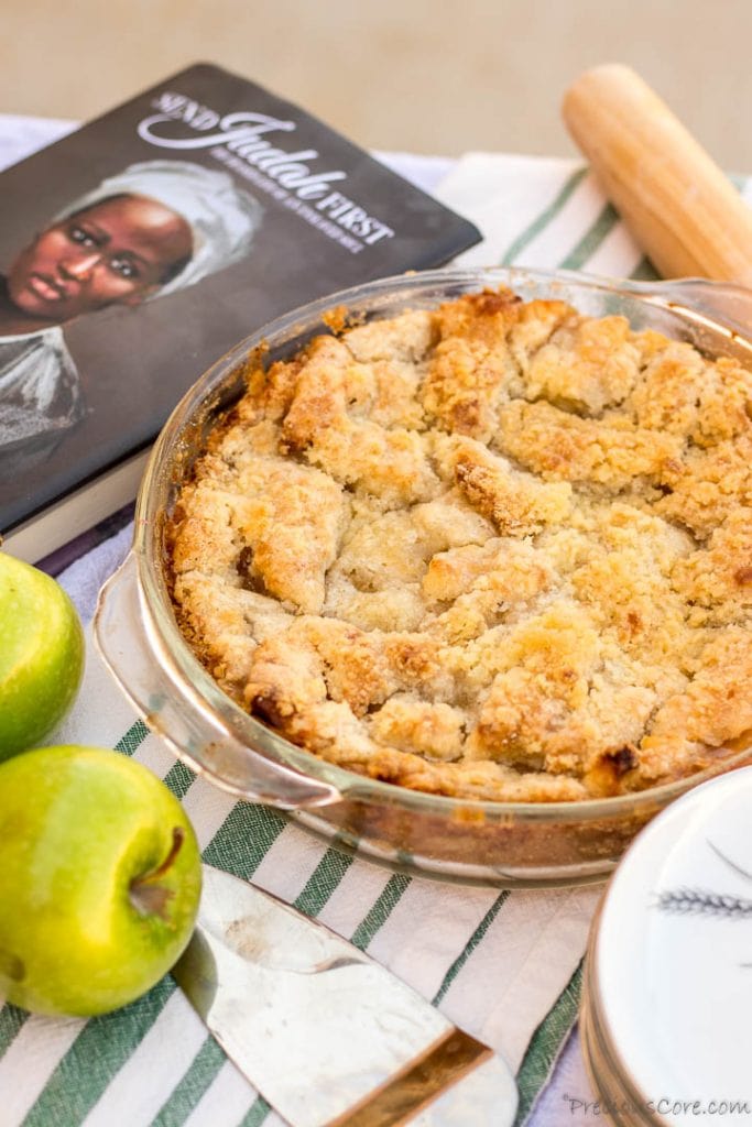 Apple Pie on table with apples and pie spoon