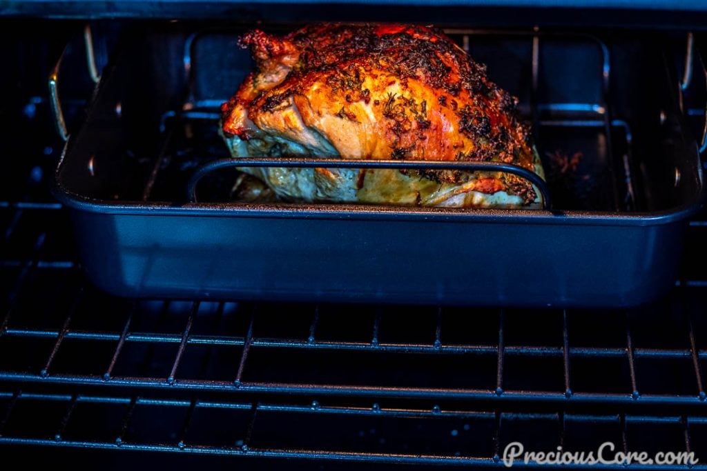 Double turkey breast baking in oven