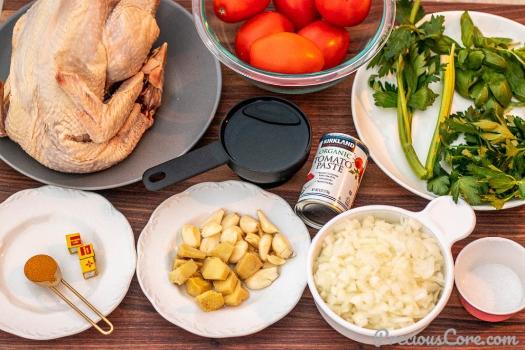 Ingredients for African chicken stew on a chopping board