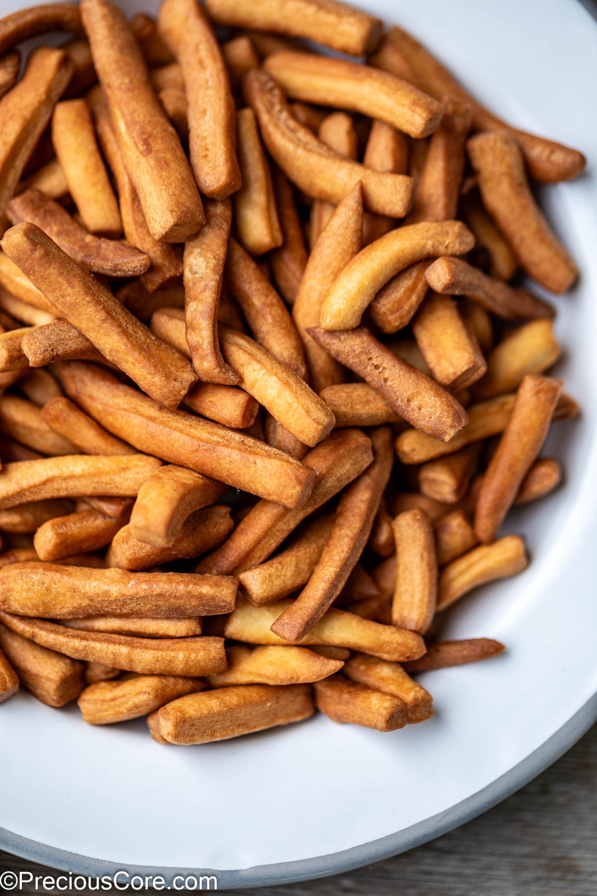 Close up of chin chin on a white plate.