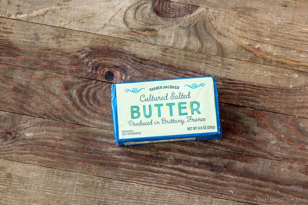 Block of French butter on a wooden board